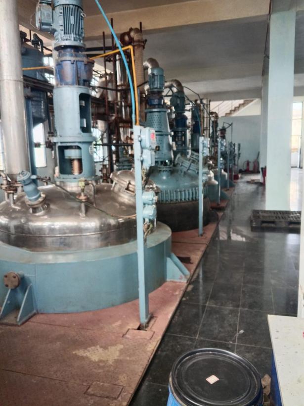 Reactor train receding down the production floor
