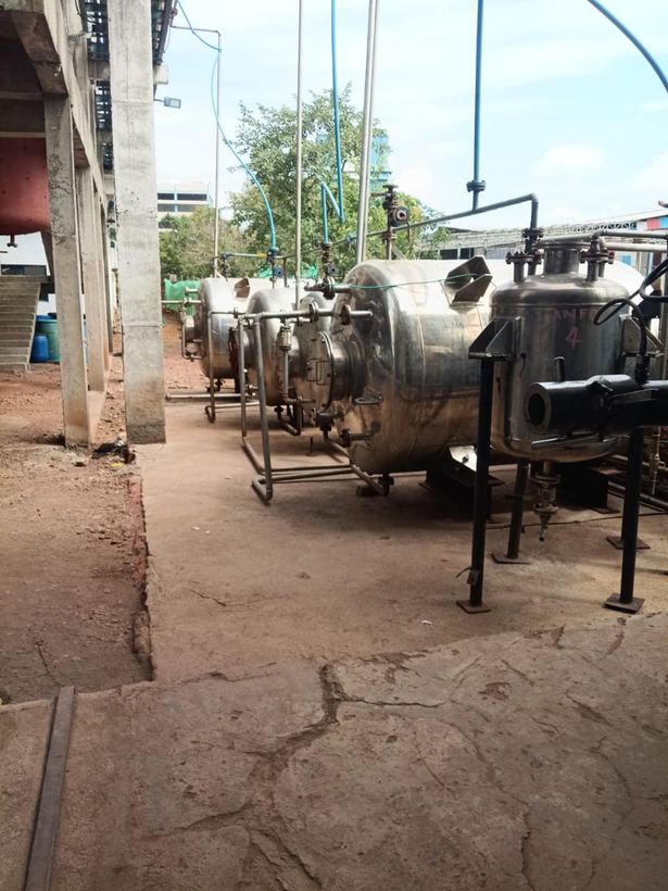 Stainless steel vessels installed outdoors alongside the plant